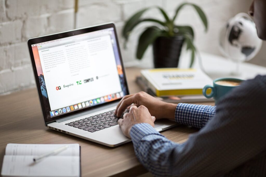 man at laptop working on emails